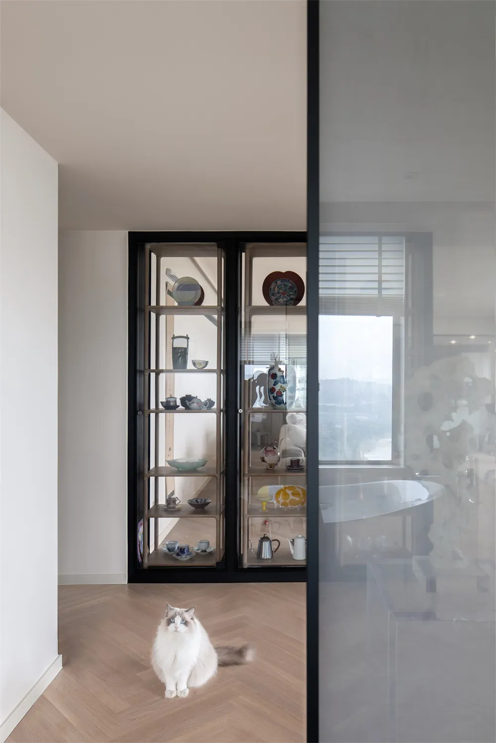 A contemporary residential space showcasing wood and glass elements.