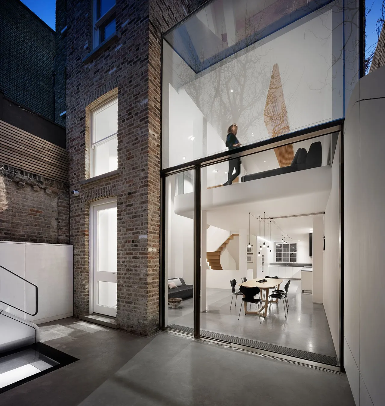 A modern residential interior featuring mixed materials and design.