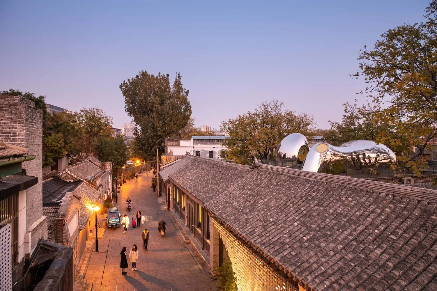 An image depicting a street view with tiled roofs.
