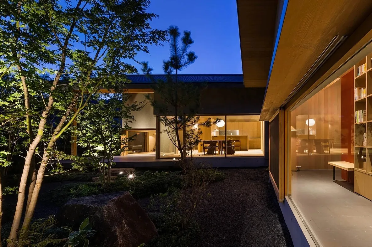 Modern residential interior featuring wooden furniture and a well-lit living area.