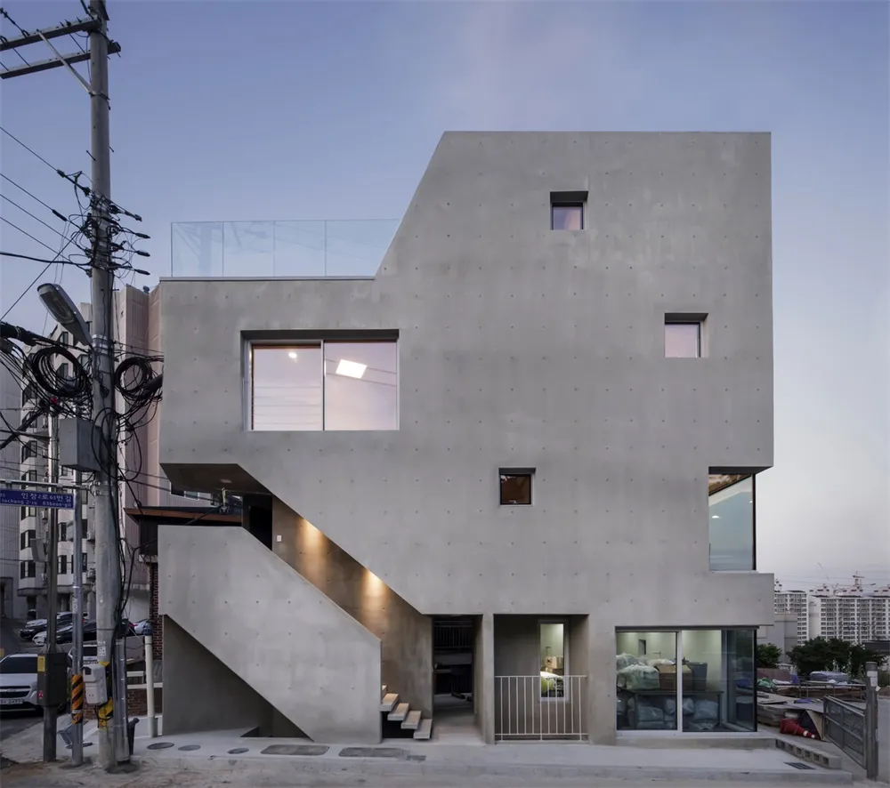 Modern, minimalist building facade constructed from concrete.