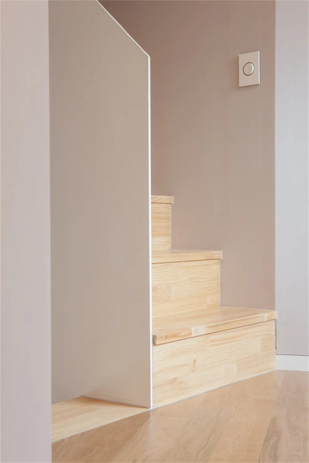 Modern interior staircase made of light-colored wood