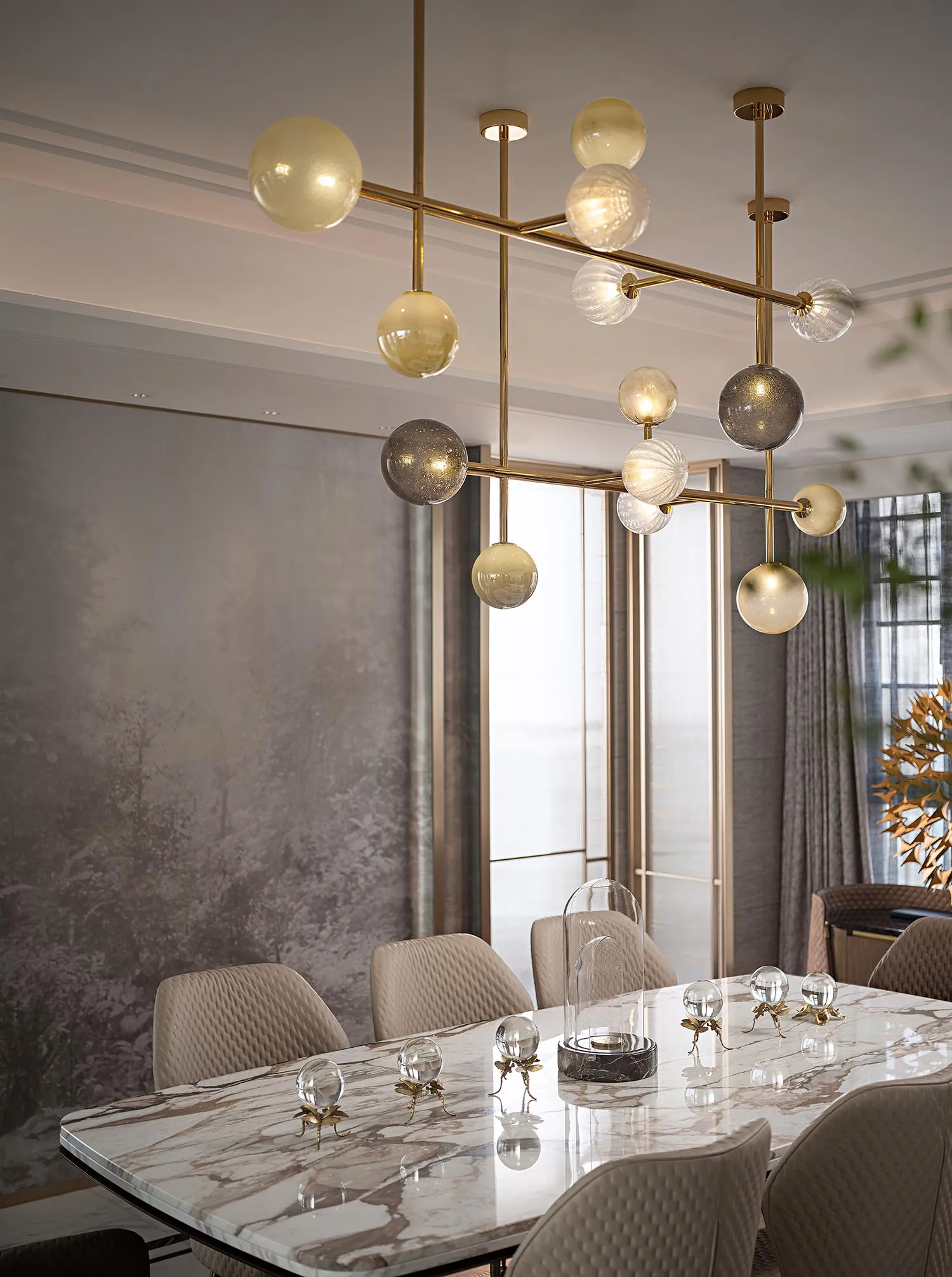 Modern marble dining room with contemporary lighting fixture and plush chairs.