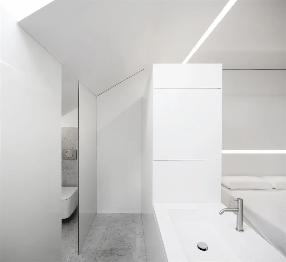 Modern white concrete bathroom suite featuring a sleek design and minimalistic style.