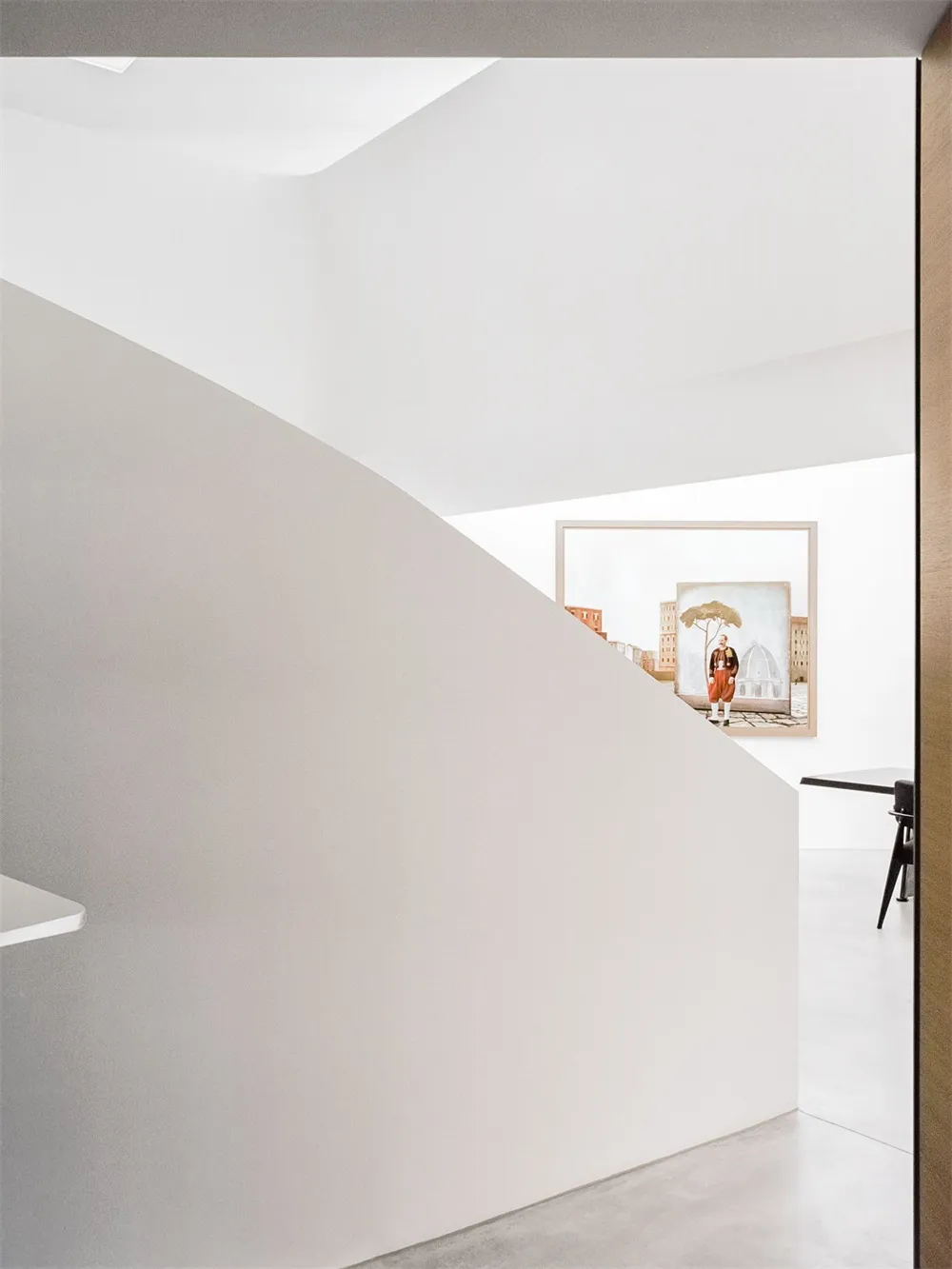 A modern interior space with concrete walls and minimalist design.