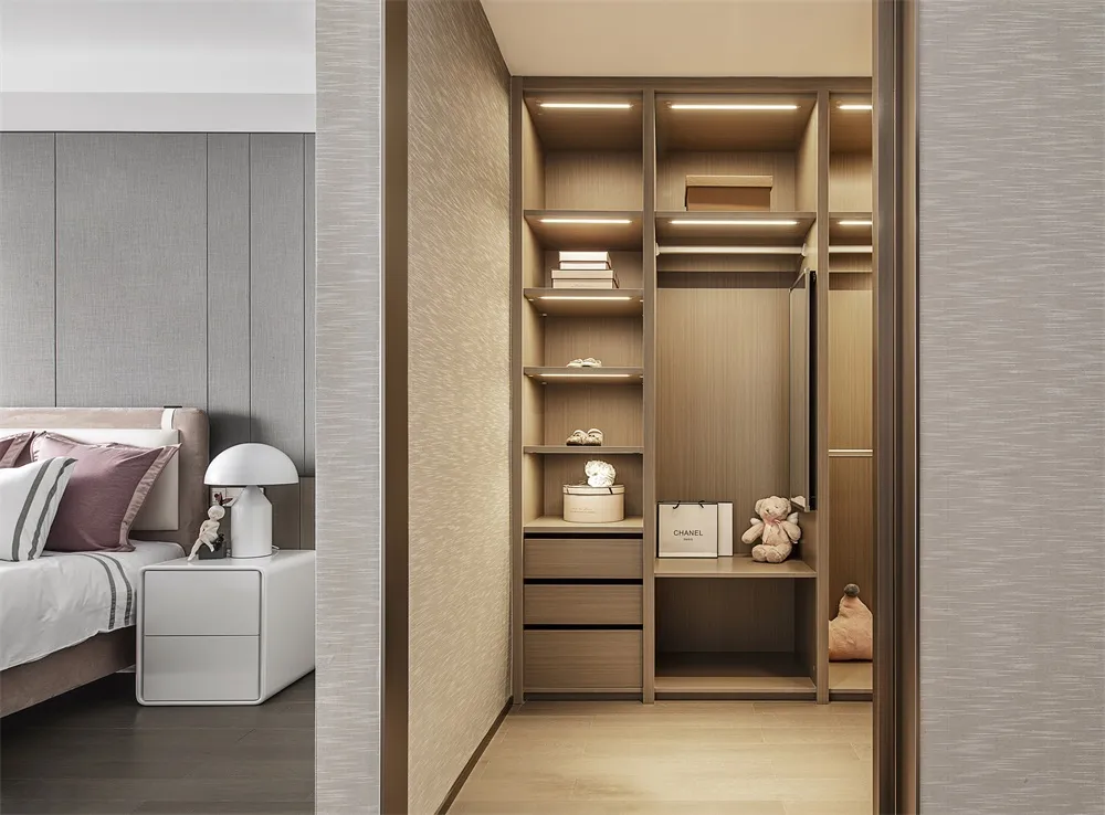 Organized modern bedroom storage with black and white accents.