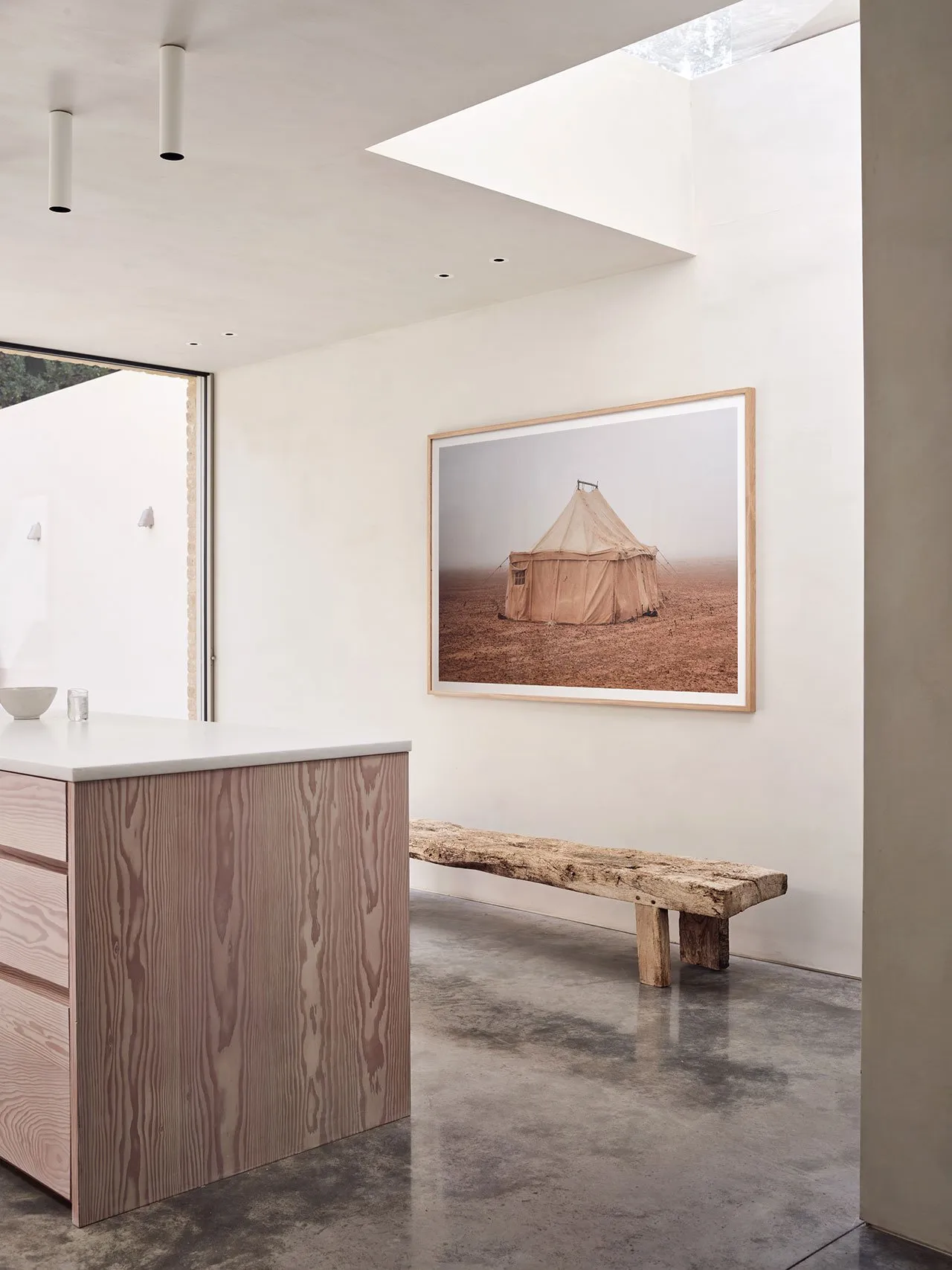 Modern kitchen with concrete countertop and wooden island