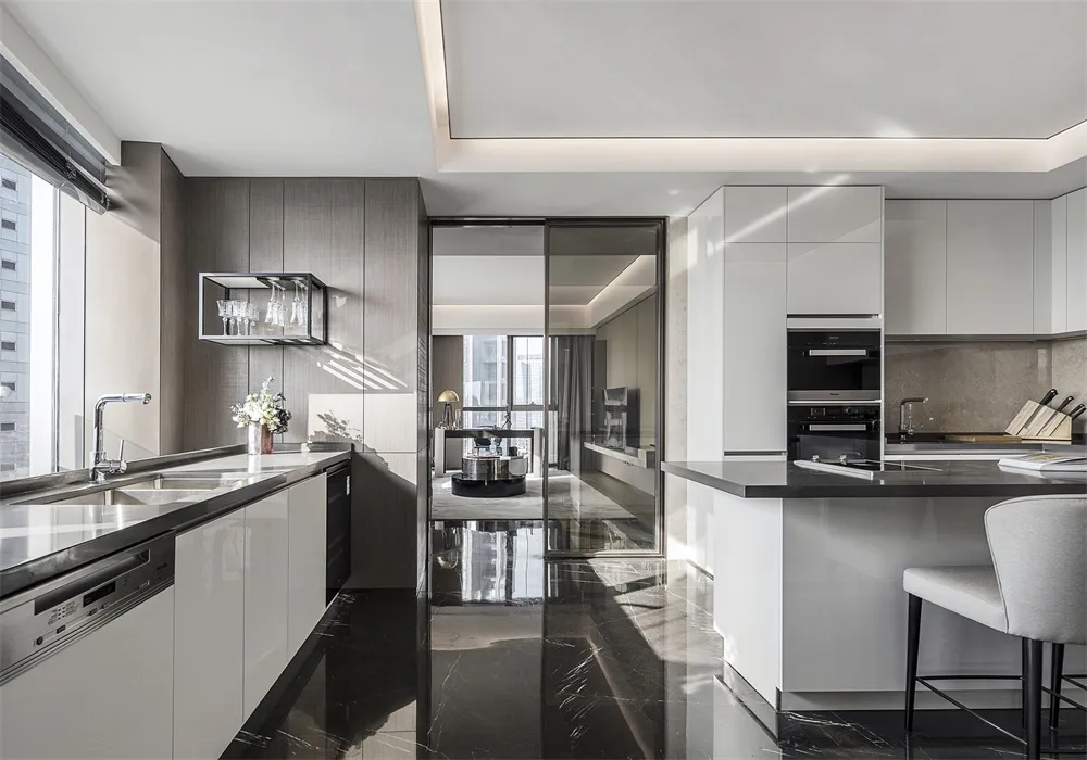 Modern kitchen featuring glass, marble, and stainless steel materials