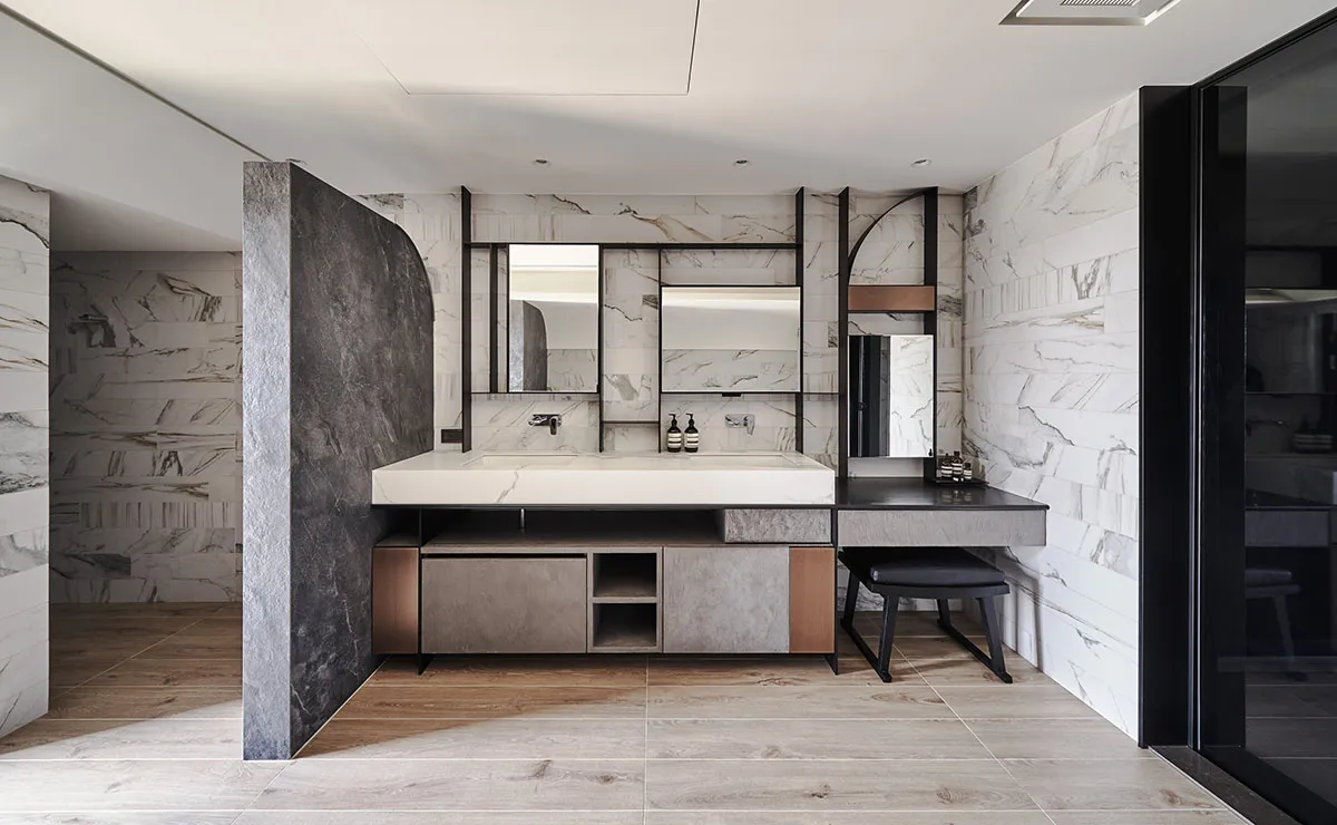 Modern bathroom featuring marble and concrete surfaces with a minimalist design.