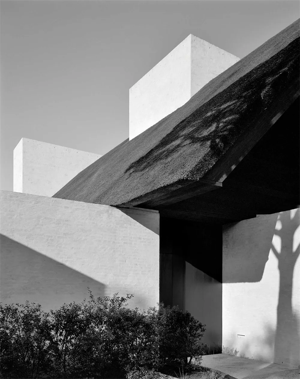 Modern minimalist house featuring concrete exterior.