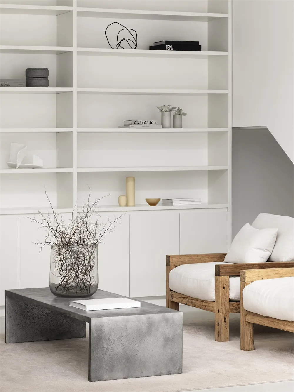 Modern living room with concrete furniture and minimalist decor.