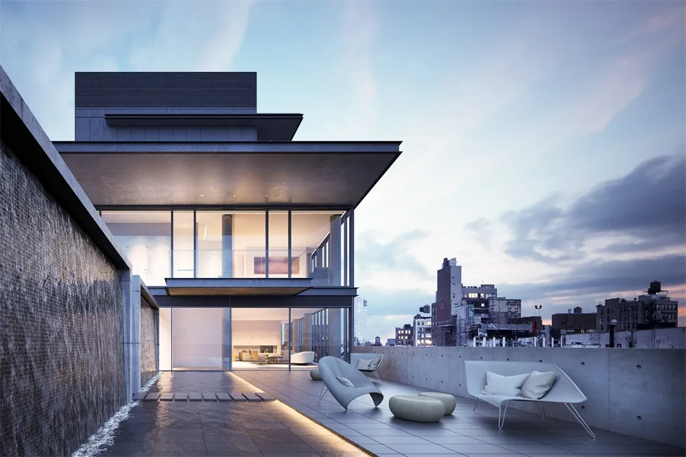 Modem residential building with glass walls, concrete surfaces, and a waterfall feature