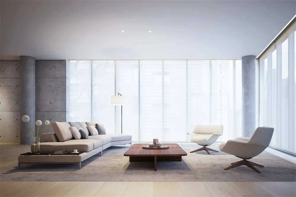 Modern living room featuring concrete, glass, and furniture.