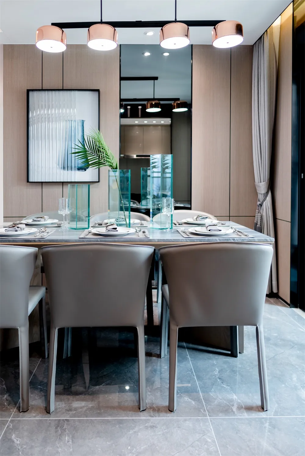 Modern dining room with a glass table, minimalist design, and sleek, contemporary chairs.