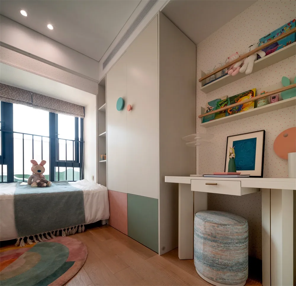A modern children's bedroom featuring colorful furniture and decorative elements.