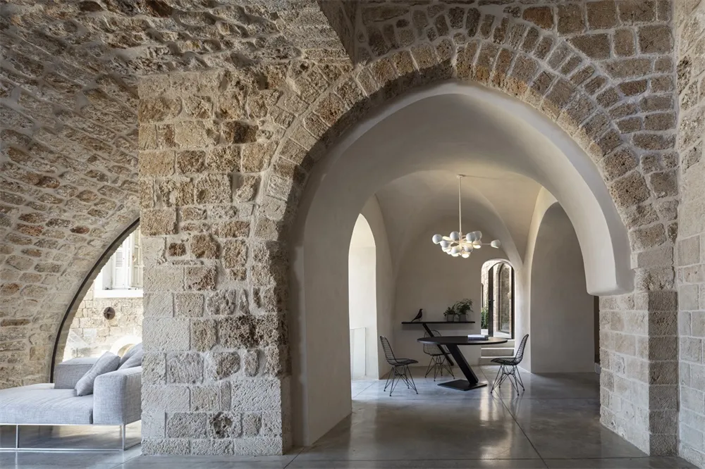 Industrial-style interior with stone and concrete elements.