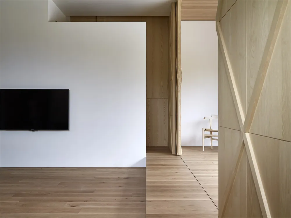 Modern minimalist interior design featuring wooden elements.