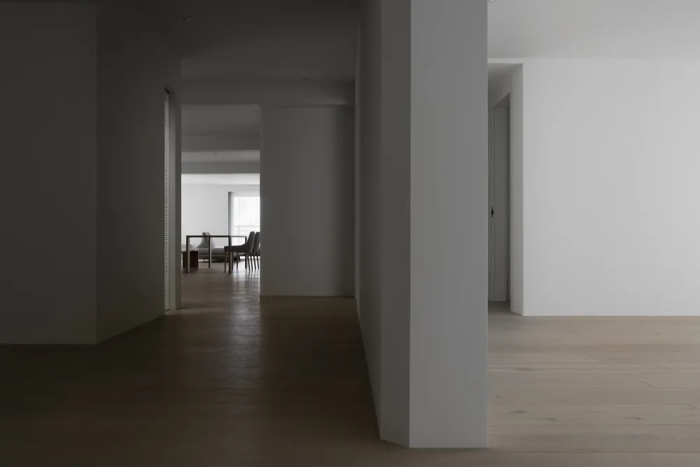 An interior design showcasing modern elements with light wood flooring.
