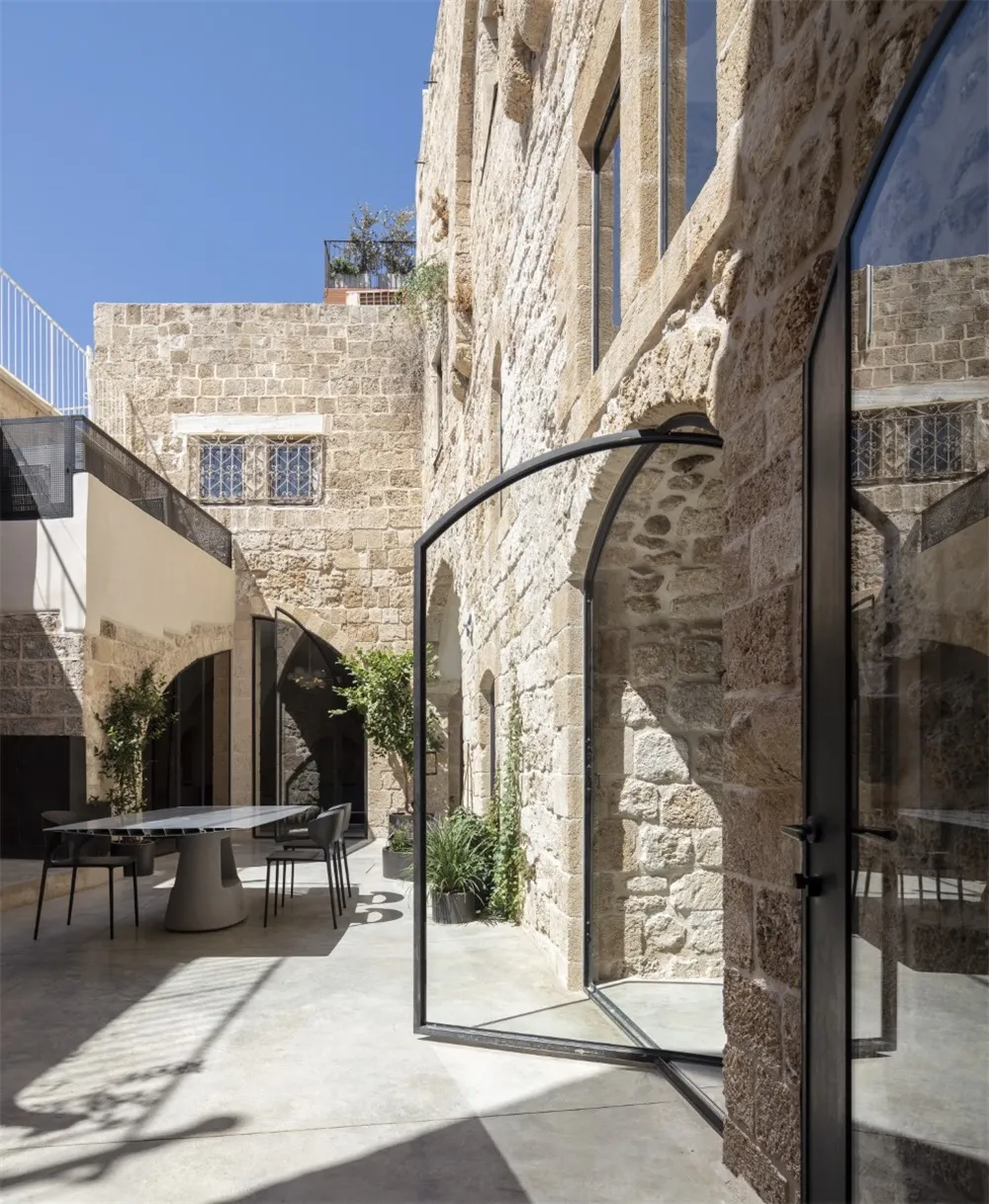 A modern rooftop designed with concrete and stone materials.