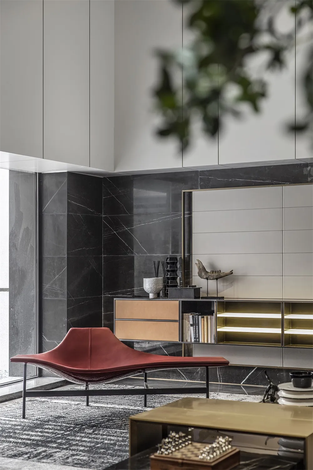 Modern minimalist living room with black marble accents, sleek furniture, and geometric design elements.