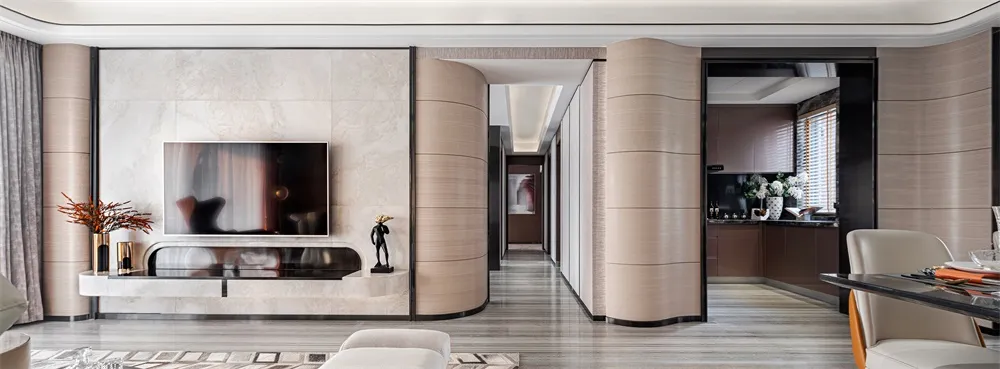 A contemporary living room with marble walls and a sleek, minimalist furniture arrangement.