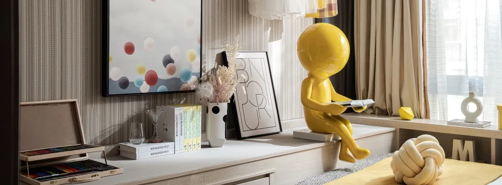 Modern living room with yellow plastic figures, books, and decorative objects.