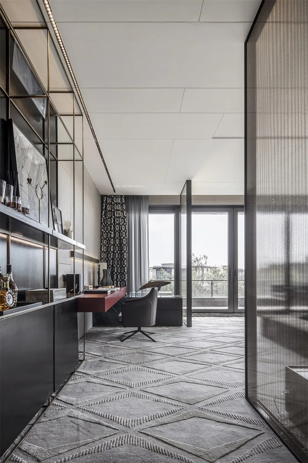 Modern office space with industrial design elements, featuring a sleek desk, comfortable chair, and minimalist decor.