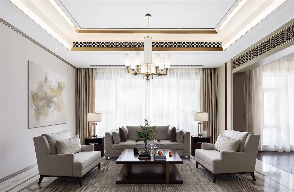 A modern living room with neutral-toned fabric furniture, light wood accents, and large windows with white curtains.
