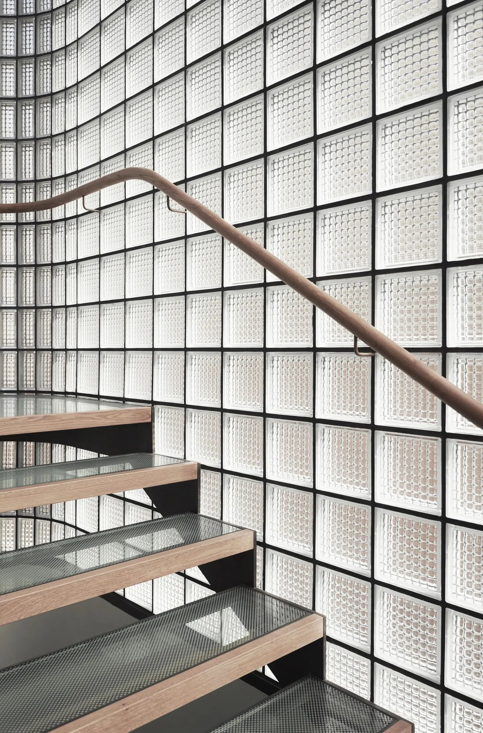 Modern staircase designed with glass blocks and lighting fixtures.