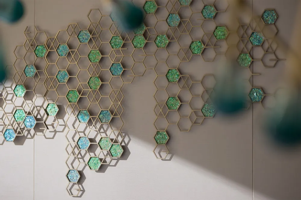 Modern interior design featuring a wall art hexagon pattern with a metal hexagonal grid and foam insulation.