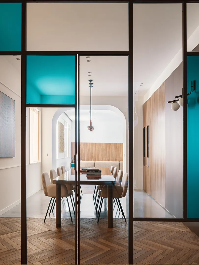 Modern dining room featuring wooden furniture and a wooden floor.