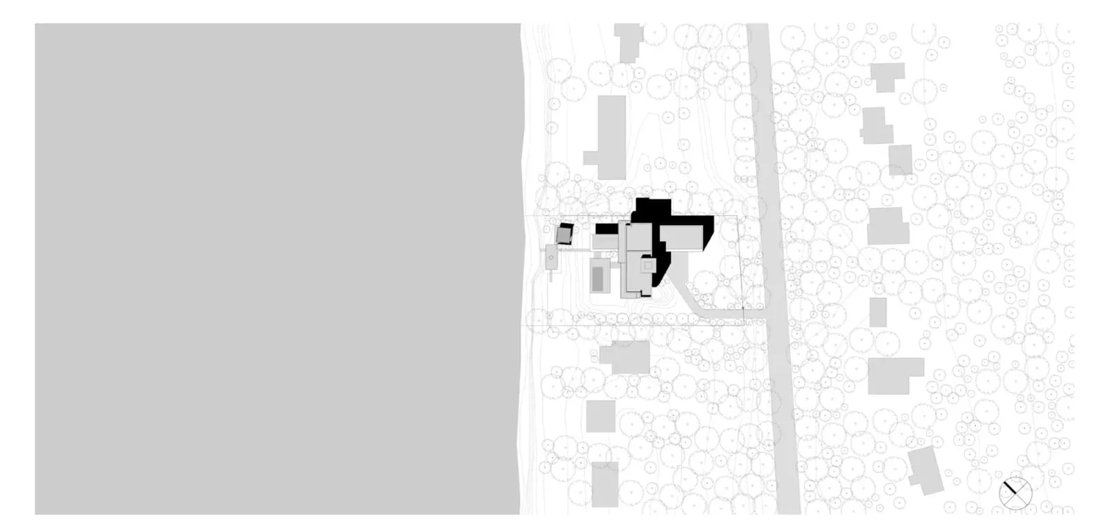 Minimalist architectural drawing on paper showing geometric layout.
