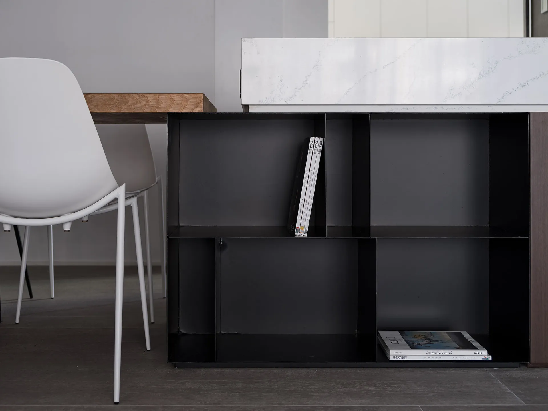 A modern, industrial-style metal bookshelf with minimalist design.
