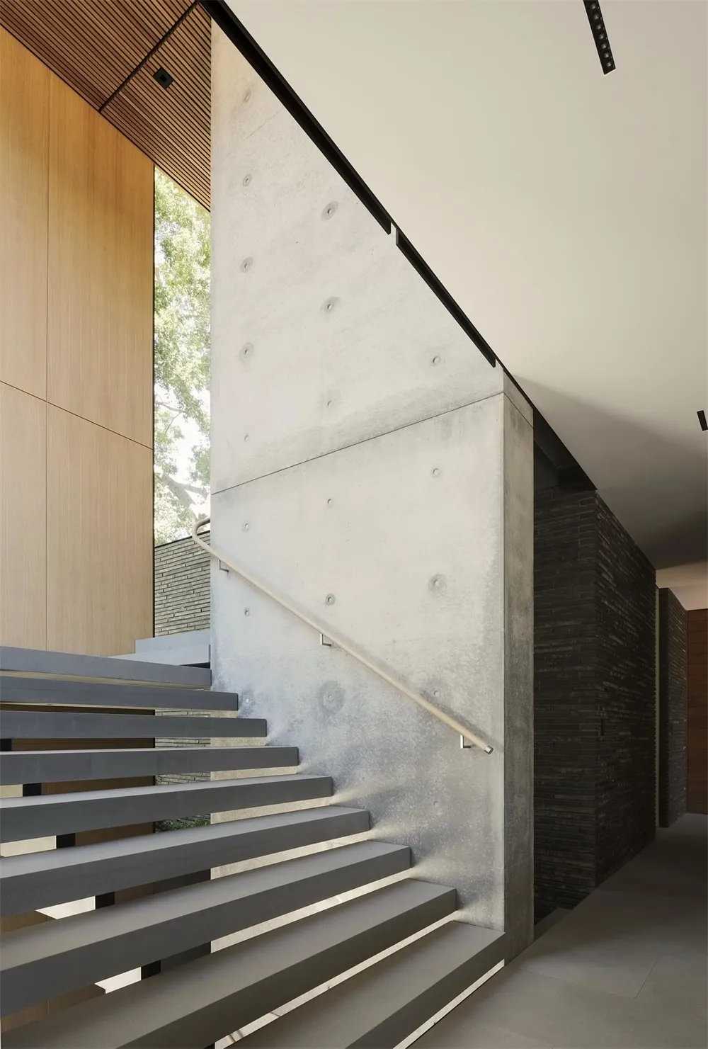 Modern interior with concrete stairs and minimalist design.