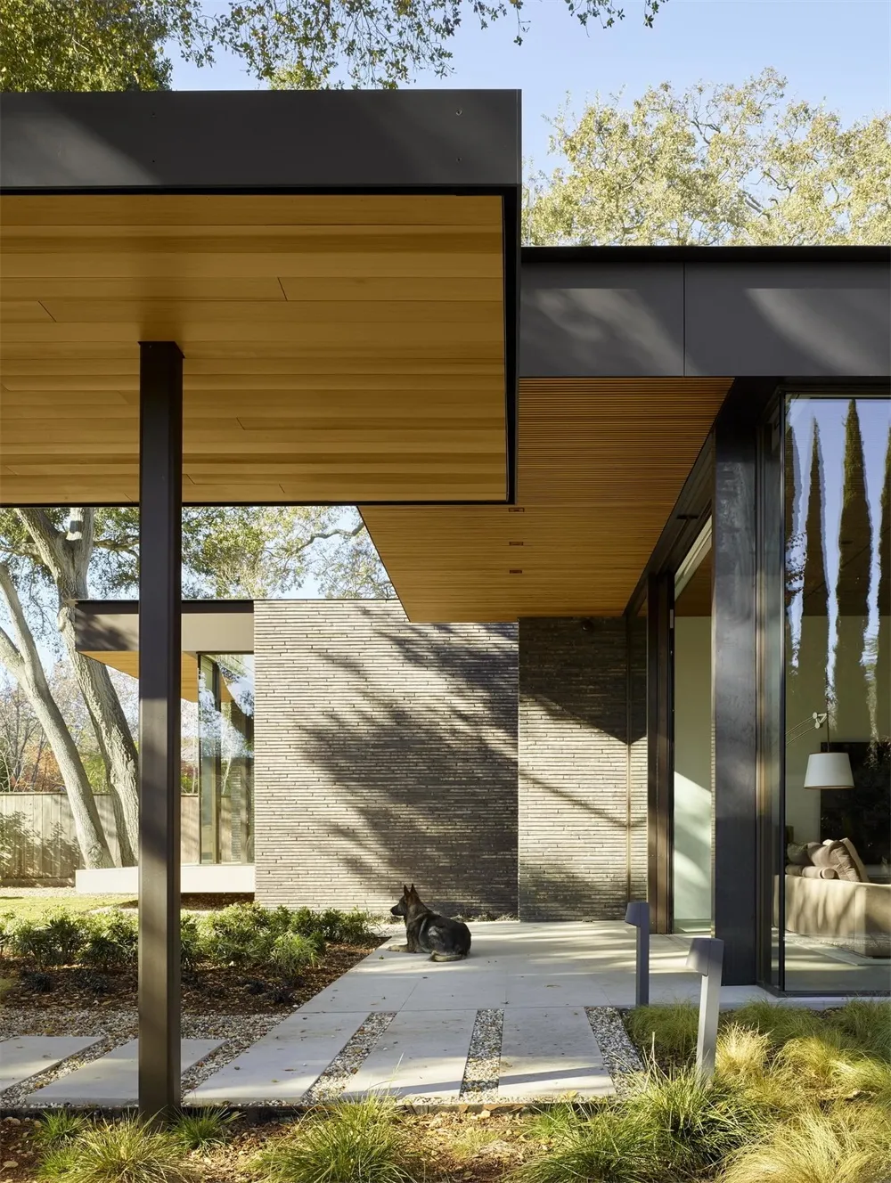A modern entryway featuring wood and concrete materials.
