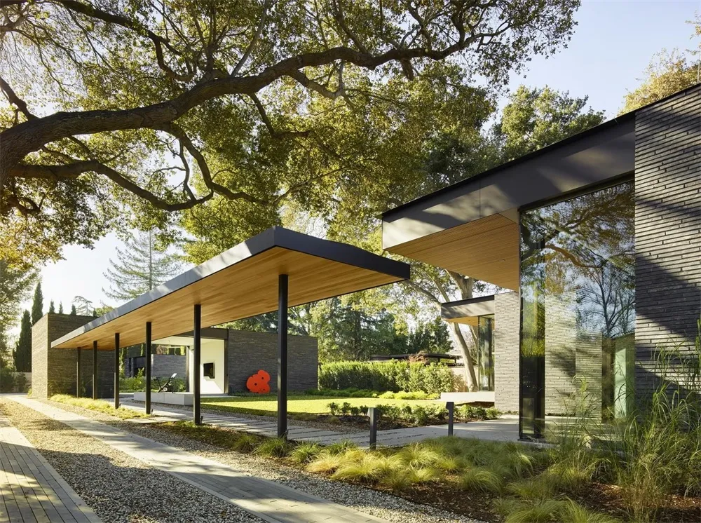 Modern house exterior with concrete, wood, and glass materials