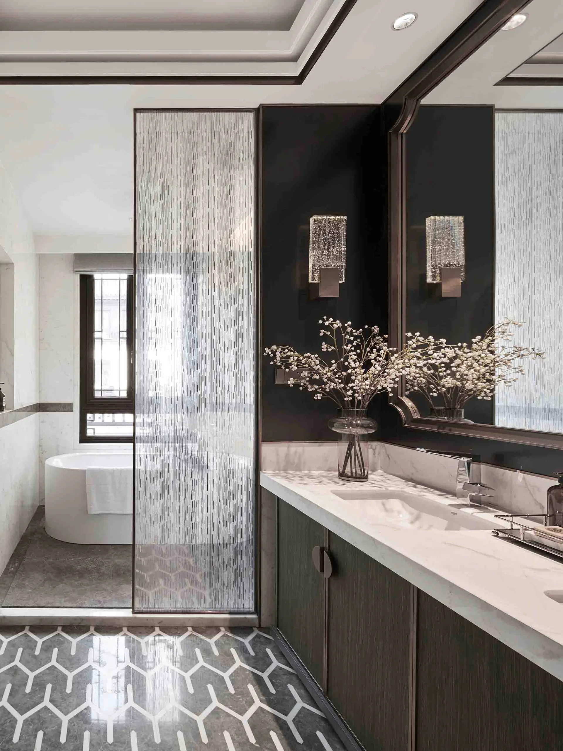 Modern bathroom with glass tiles and wooden vanity