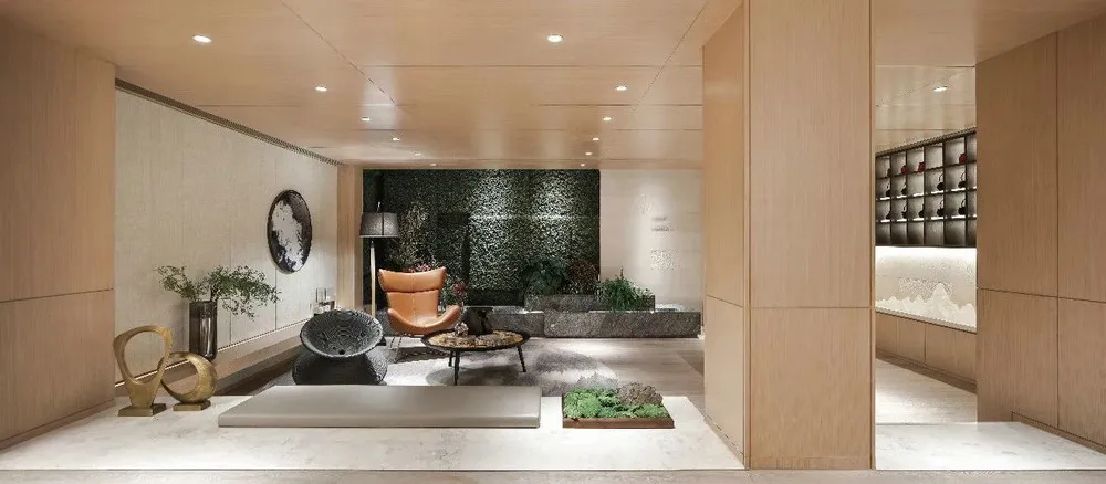 Modern living room featuring wooden furniture, a green wall, and a plant.