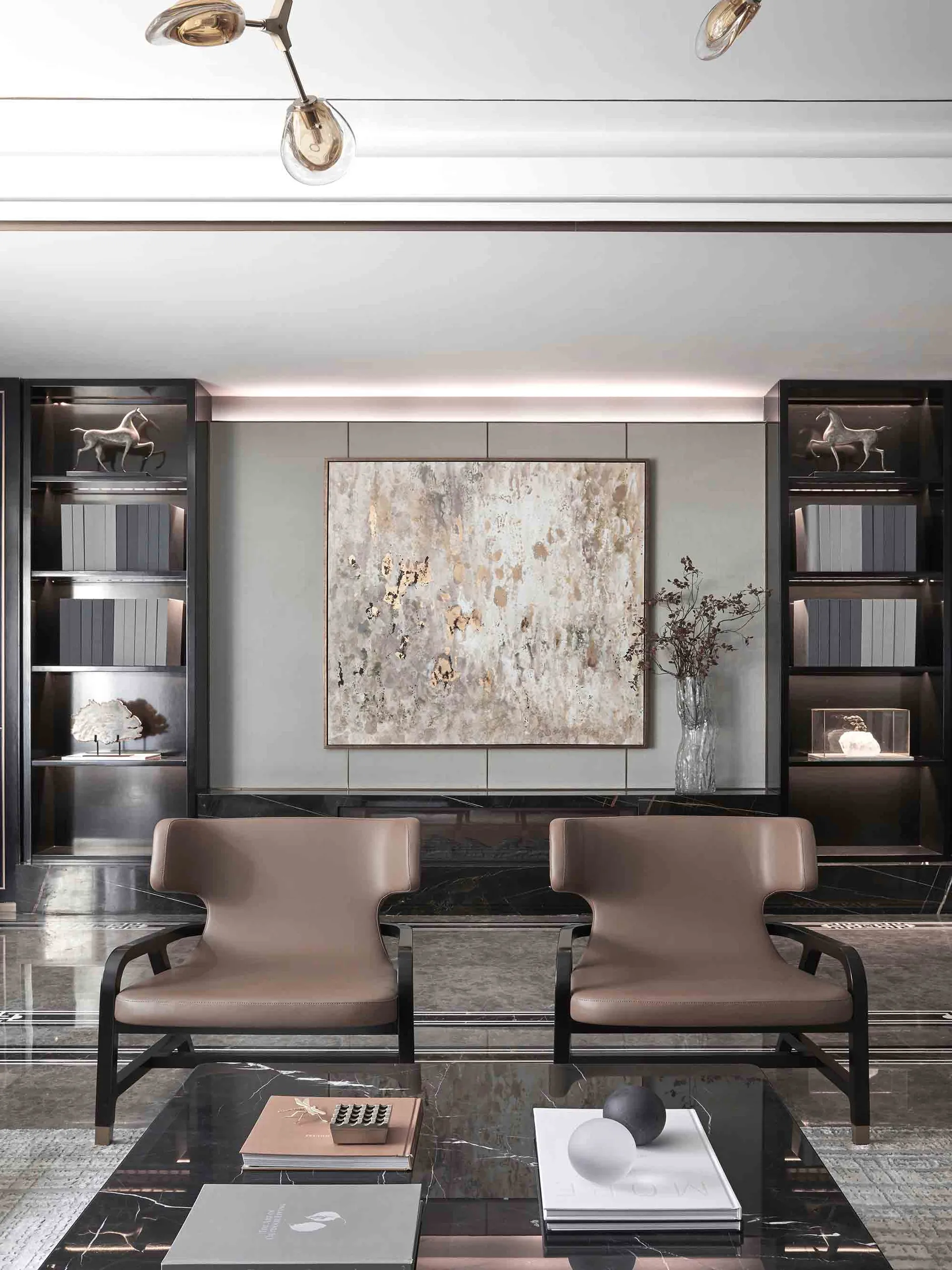 Modern living room with a marble coffee table, leather chairs, and abstract art.