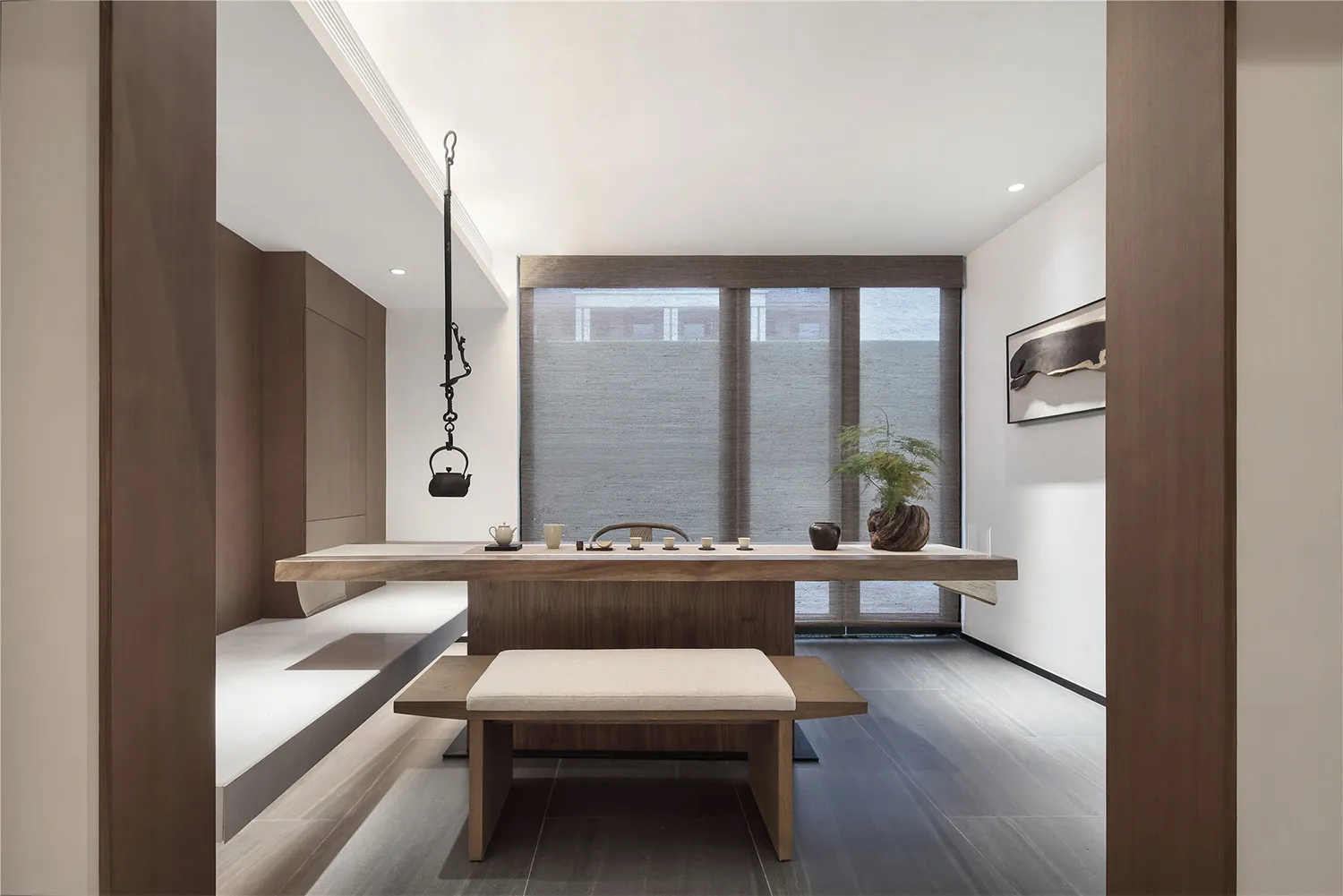 A modern minimalist living room with wooden furniture and glass windows.