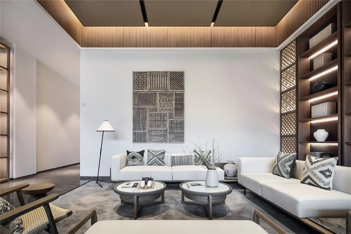 A minimalist living room with neutral tones and modern furniture.