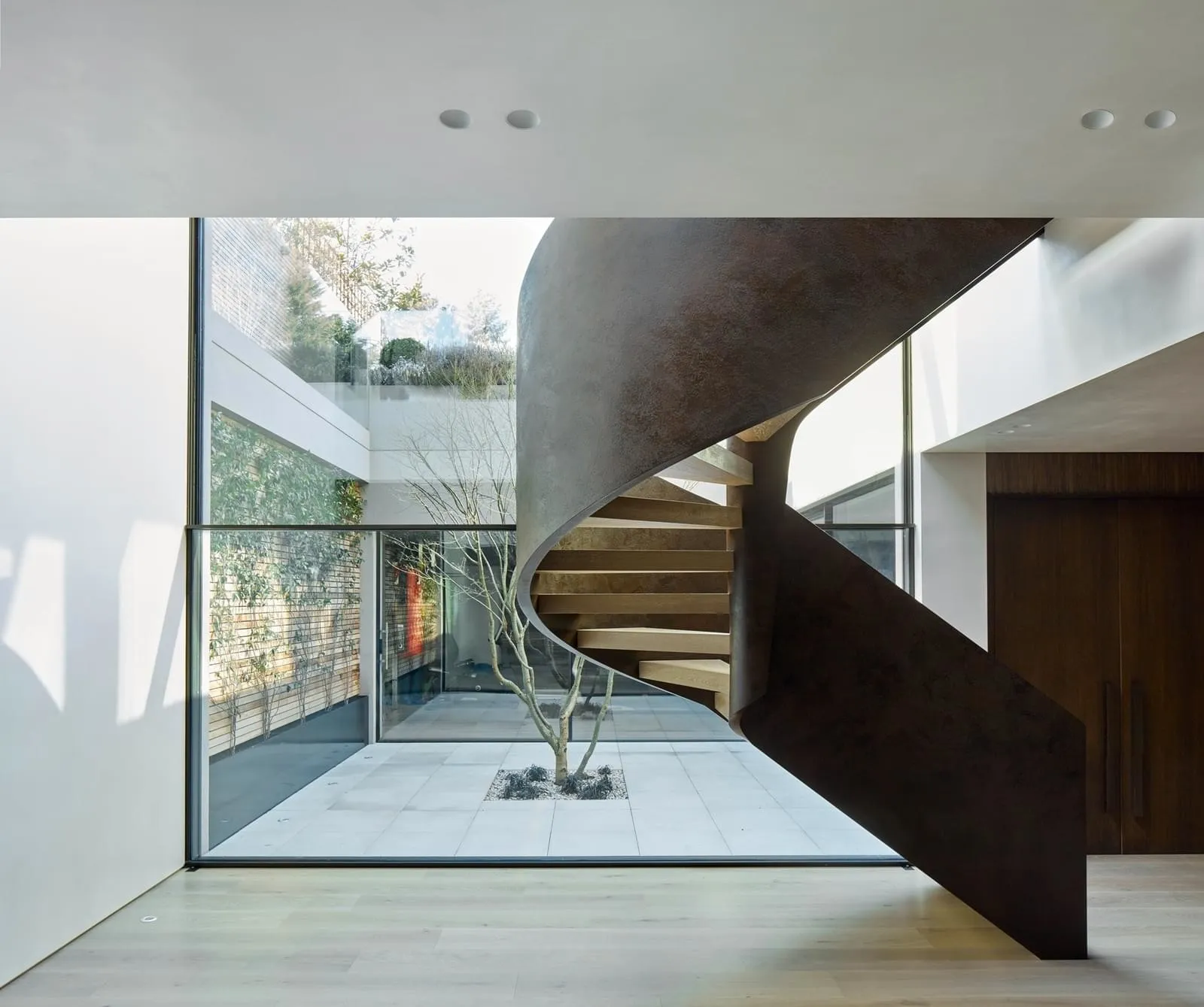 Industrial-inspired staircase made of metal in a modern interior design setting.