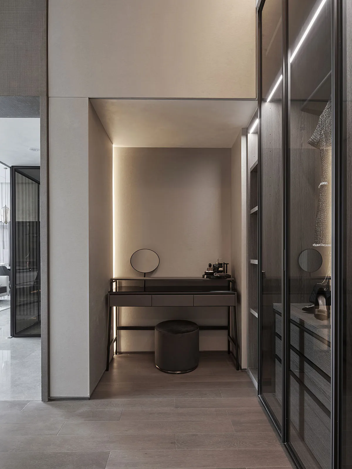 Modern, minimalist home office with wood accents and glass wall.