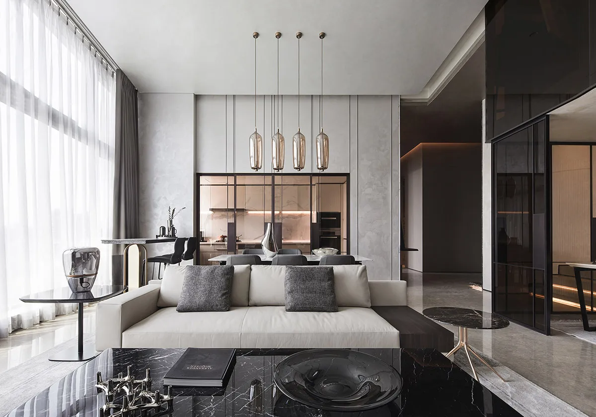 Modern living room with concrete, marble, and glass elements
