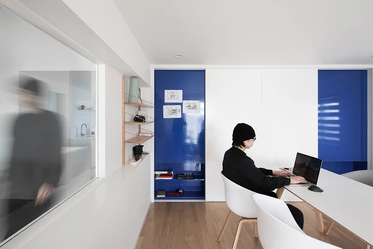 A minimalist office space featuring mixed materials