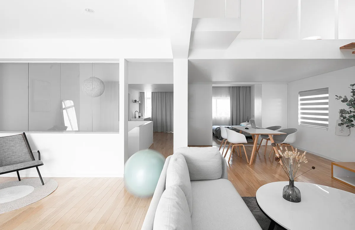 A modern minimalist living room featuring wooden furniture and decor.