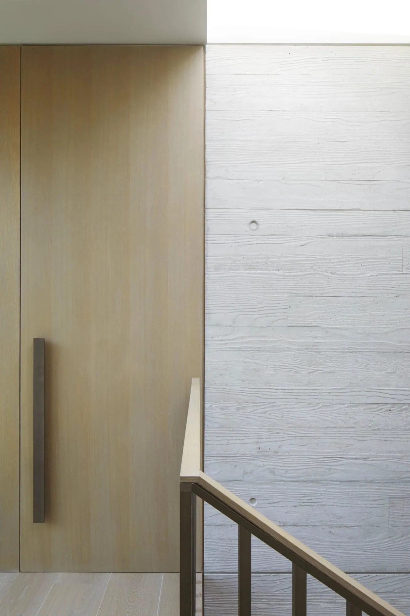 Modern staircase with concrete and wood elements