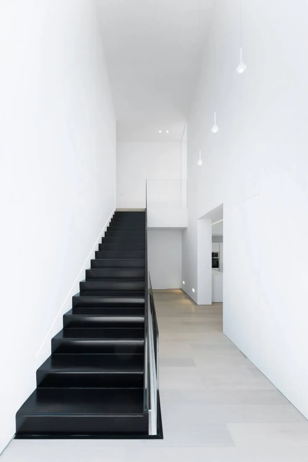 Modern black stairs with white walls interior design