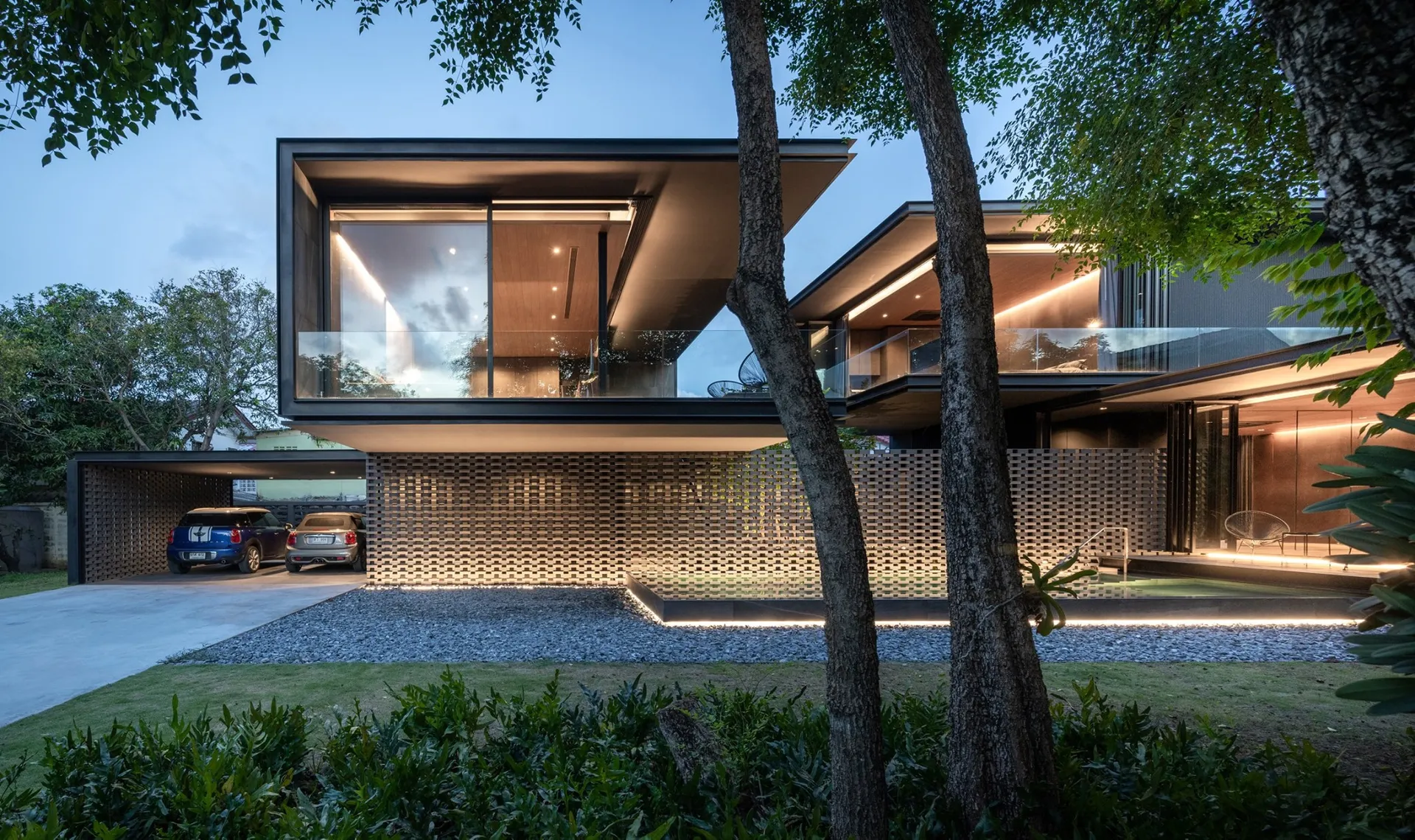 A modern house with concrete, glass, and metal materials.