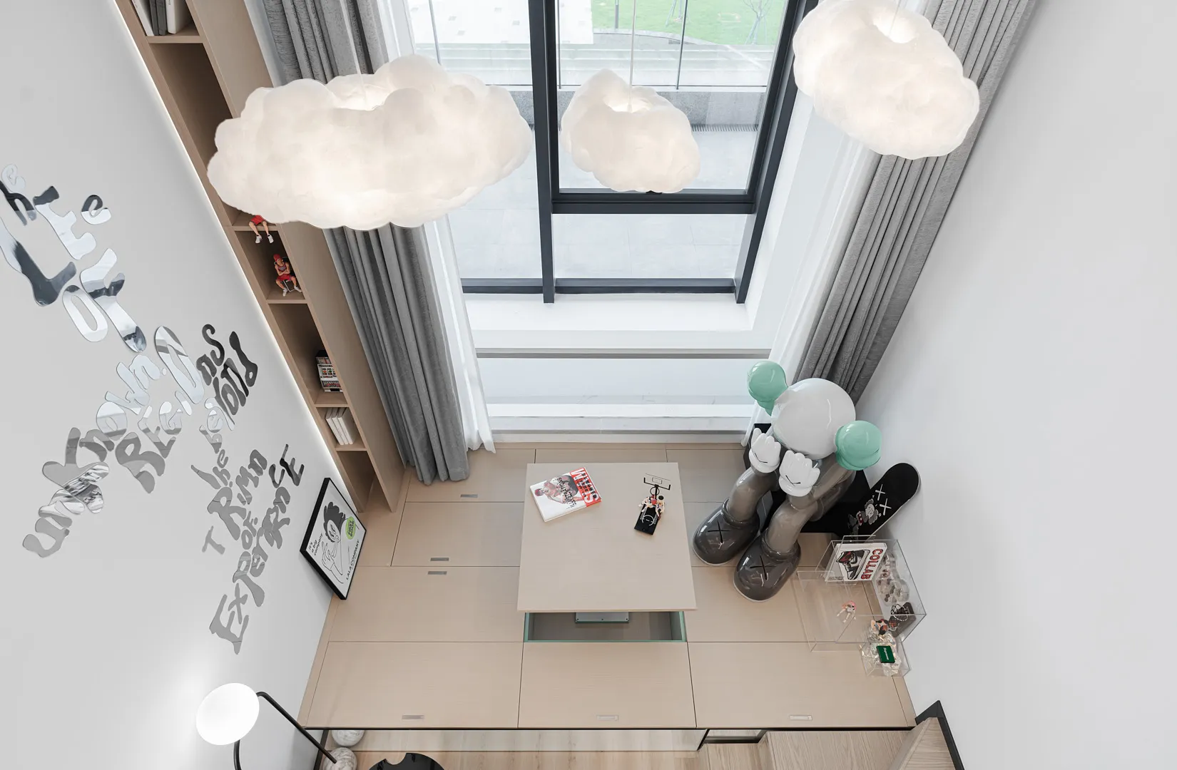 Modern living room featuring wooden furniture, glass windows, and fabric upholstery